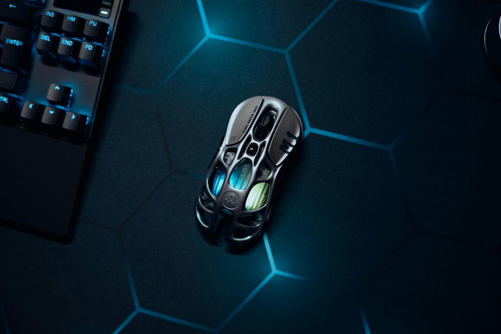 High-tech gaming mouse on a hexagonal-patterned surface with ambient lighting.